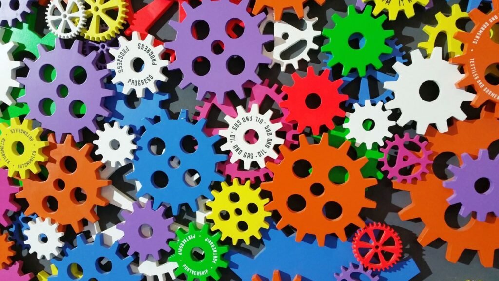 Colorful interlocking gears representing teamwork and collaboration